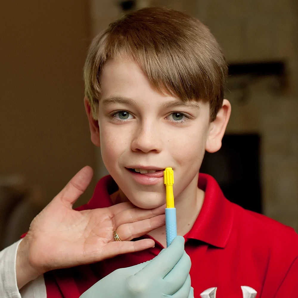 Boy receives support with an oral motor probe